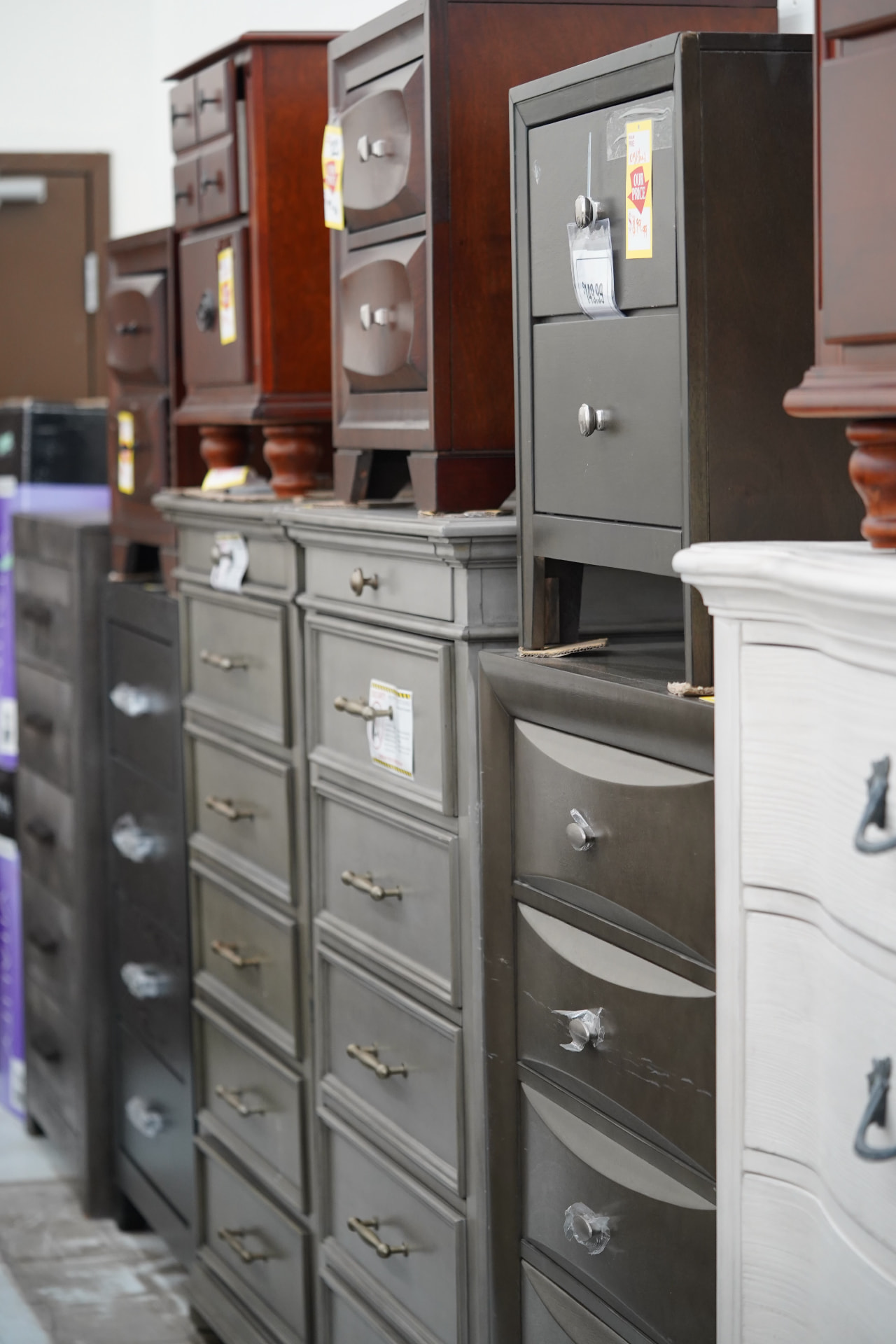 Rows of dressers and nightstands at Deals on Wheels