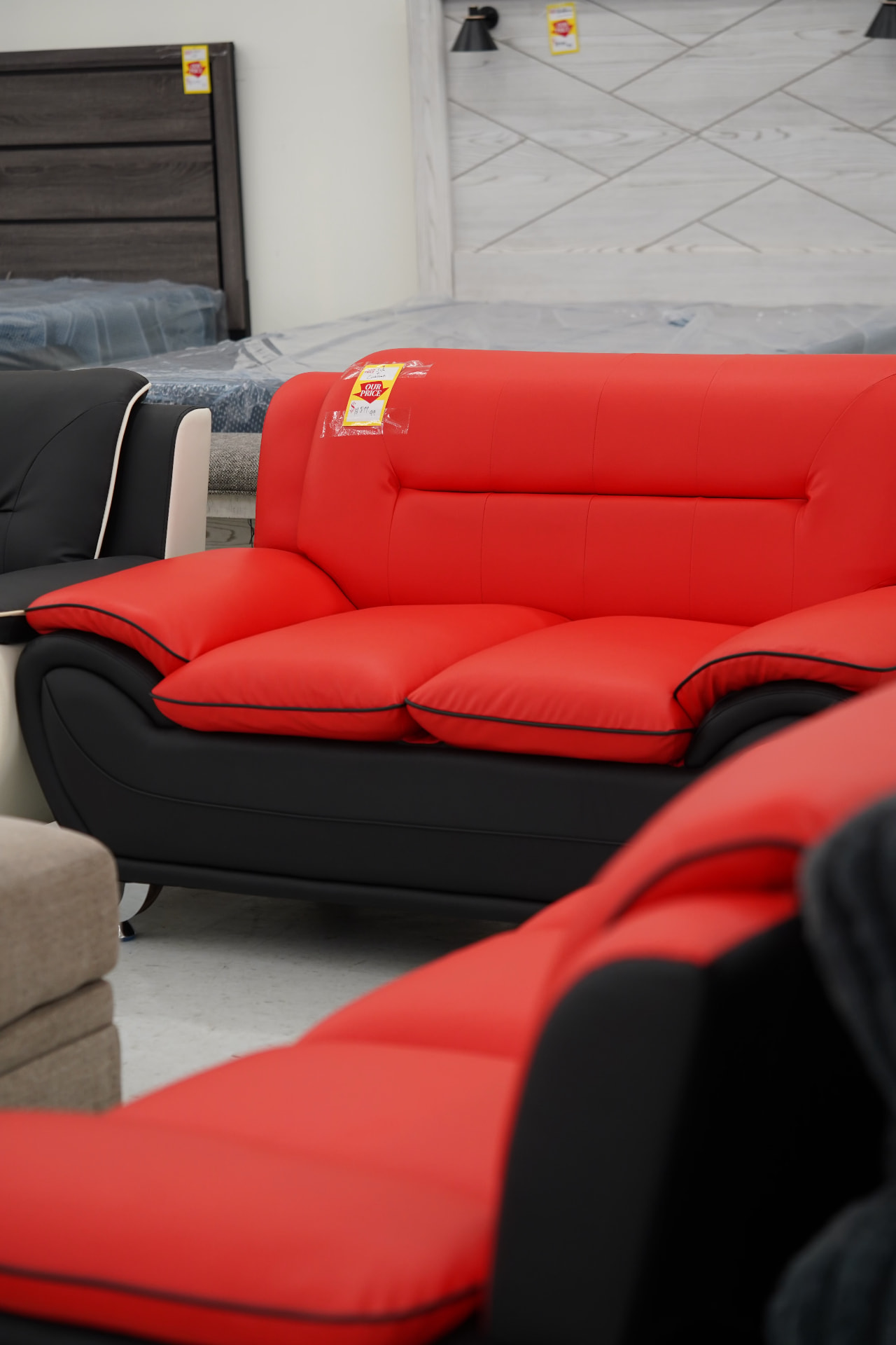 Red and black seating on display at Deals on Wheels